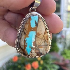 Turquoise silver pendant. Very unusual very organic looking.
